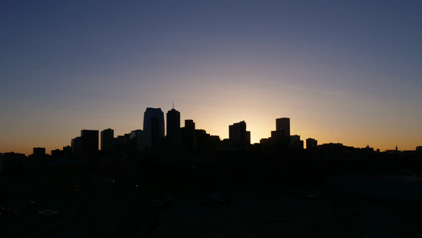 Denver Colorado skyline night to day sunrise timelapse. Wide angle, 4K UHD.