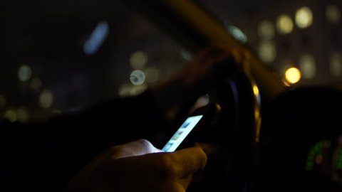 Using smartphone while driving at night in the city