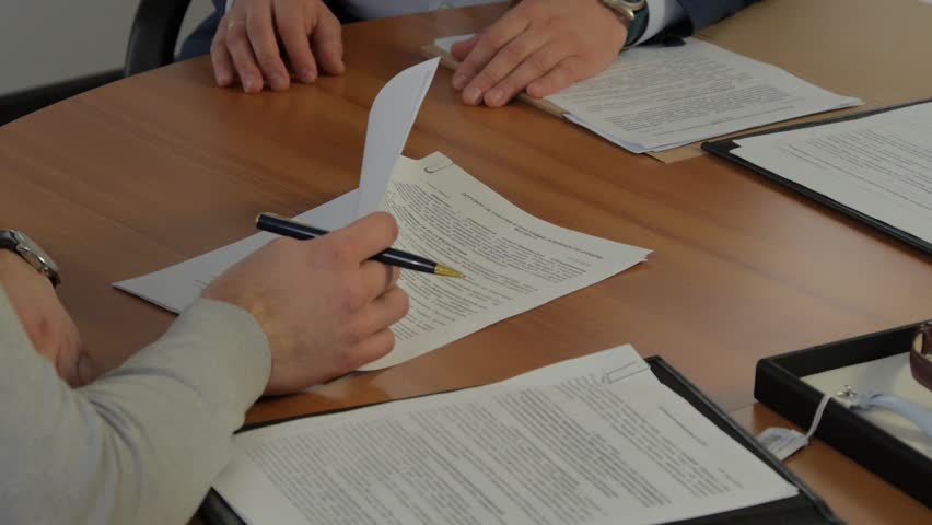 Business people signing contract,  two parties at negotiations. Royalty-Free Stock Footage #1009662251