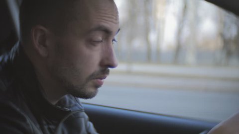 Fatigue driving car. A man rides on the vehicle of exhaustion and falls asleep.