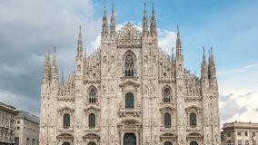 Duomo di Milano, a famous Milan Cathedral one of the best known city landmarks. Italian Gothic architecture. Clouds move across the sky, Time lapse video.