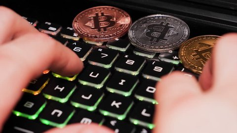 Gold, silver and bronze coin bitcoin, keyboard, Crypto currency course.