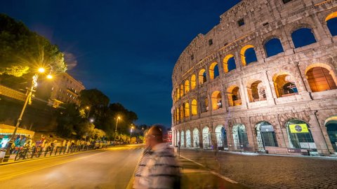 Time lapse of Rome Colosseum and crowded street of Rome , Italy . The Colosseum was built in the time of Ancient Rome in the city center. It is one of Rome most popular tourist attractions in Italy .
