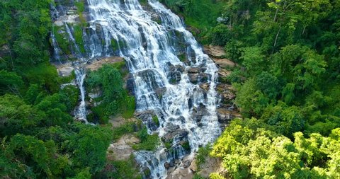 Aerial view of Maeya Waterfall , large waterfall located deep in forest of Chiang Mai, north of Thailand. The beautiful cascade of this waterfall gives a fresh nature landcape for all jungle tourists.