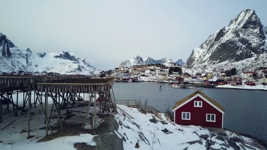 4k Drone footage - Racks of dried cod fish in Reine, Norway.  Lofoten Islands