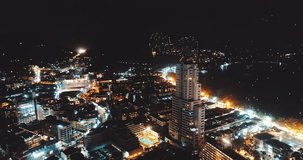 Aerial drone view of fireworks above the city on New Year's Eve - video in slow motion
