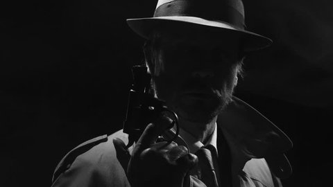 Retro detective spy holding a revolver in the dark and looking around, noir film character