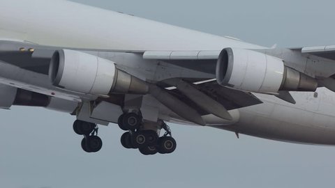 airplane huge jumbo jet 747 super slow motion panning right left details engine landing gears