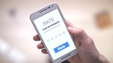 giving a 5 stars rating review on a smartphone device.