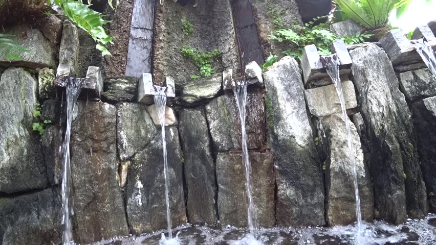 Fountains in a park among beautiful leaves