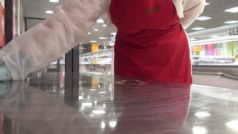 Cleaning cutting table from remnants of food. Application of disinfectant solution. Washing of premises and equipment in food industry, supermarkets, warehouses with food and other similar places.