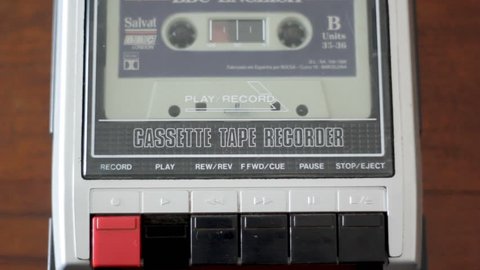 Insert cassette on old retro cassete tape recorder. Top view