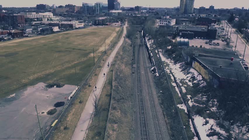 Drone shot of train tracks through the city of Ottawa.