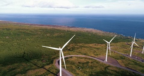 Aerial view of windmills on hawaii. Concept of renewable energy, wind power, climate change.