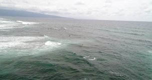 Aerial shot of surfer on the waves, Hawaii