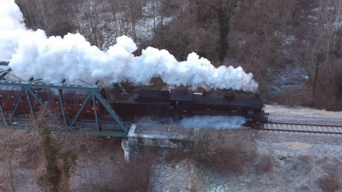 Historic steam train cross the iron bridge