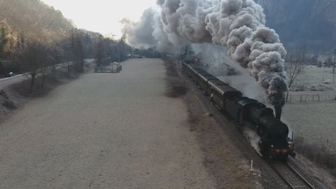 Historic steam train rolling through the valley