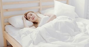woman wake up and leave bed in the bedroom