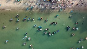 Aerial view panorama Mui Ne fishing harbour from drone. Royalty high-quality free stock footage of Mui Ne fishing harbour or fishing village. Fishing harbor is popular tourist destination. Vietnam
