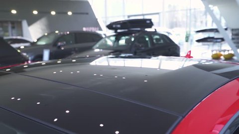 Vehicle, modern car, opening of the car sunroof, view of car exterior.
