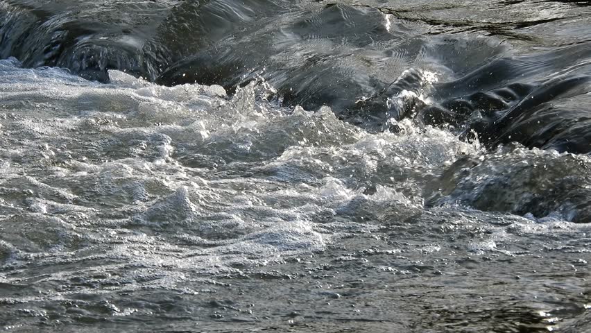 Small fast stream flow on beautiful river