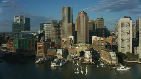 Aerial city view of Rowes Wharf city skyscraper buildings in downtown Boston Financial office business district Main Channel harbor Waterfront Massachusetts America