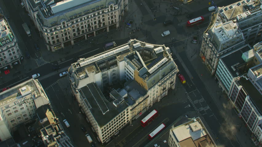 Aerial view at sunrise Oxford Circus buildings vehicle traffic and pedestrians City of Westminster London England UK RED WEAPON | Shutterstock HD Video #1009781360