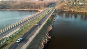 A professional shot from the drone. 
Road, driving cars, you can see a truck that is ideal for transport advertising
High tonal range, nice colors, 4k resolution, an unprecedented, unique place.

High