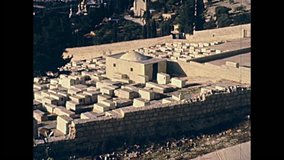 Aerial view close up of the Church of Mary Magdalene of Russian Orthodox Church and ancient Jewish cemetery from Olives Mount. Old Jerusalem city on 80s, Israel. Historic restored footage on 1980s.