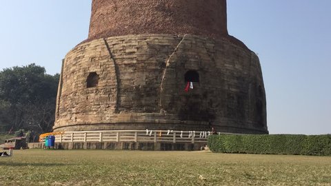 Sarnath, India - January 27, 2018: Dhamekh Stupa in Sarnath near Varanasi in Uttar Pradesh Region. Built in the 5th century AD, the Stupa is the birthplace of Buddhism.