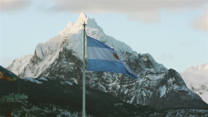 Flag of Argentina Waving With Mountain Backdrop in Ushuaia, Tierra del Fuego	