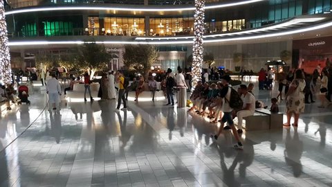 Dubai, UAE - April 8. 2018. Tourists in front of world famous shopping center Dubai Mall