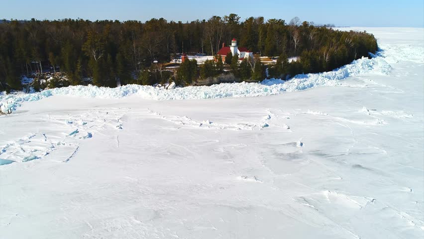 Scenic Little lighthouse on the edge of the World, aerial view. Sherwood Point Lighthouse is near Sturgeon Bay, Wisconsin, and this is in April.