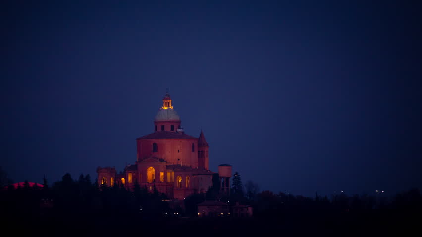 Supermoon rising over San Luca Monastero, Bologna, Emilia Romagna, Italy. Time Lapse at night