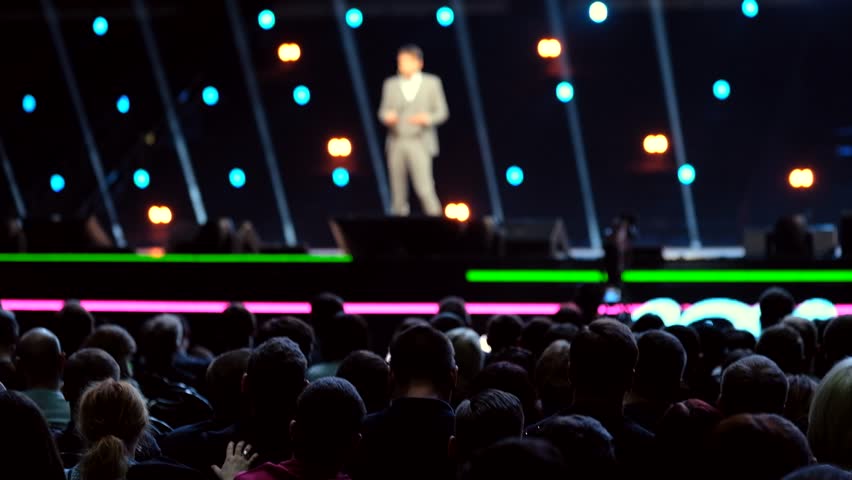 Audience listens to the lecturer at the conference hall