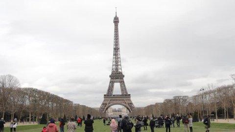 Paris, France - March 2018: Tour Eiffel Tower with tourists