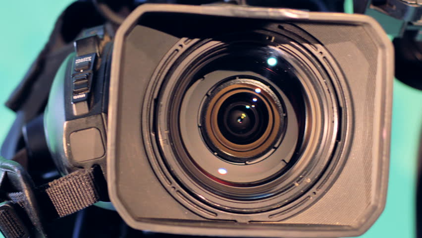 Three lenses of video cameras are shown in a close up from left to right
