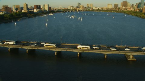 Boston, USA - November, 2017: Aerial reveal sunlight view of Massachusetts Bridge Charles river downtown city skyscrapers in the district of Cambridge Massachusetts USA