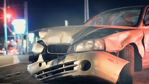 Smashed vehicle on side of road, car accident background loop 