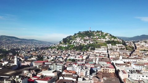 Ecuador Quito, panoramic view from the drone in flight over the historic center with blue sky in real time