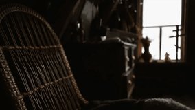 interior farmer house, dark room illuminated from window with old rocking chair and cupboard with trinket and animal skins on chair motion panorama with defocusing background - Powered by Shutterstock - Get 15% off with code: PIKWIZARD15