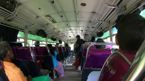 HIKKADUWA, SRI LANKA - 28 OCTOBER 2017 Man play on drum in the bus