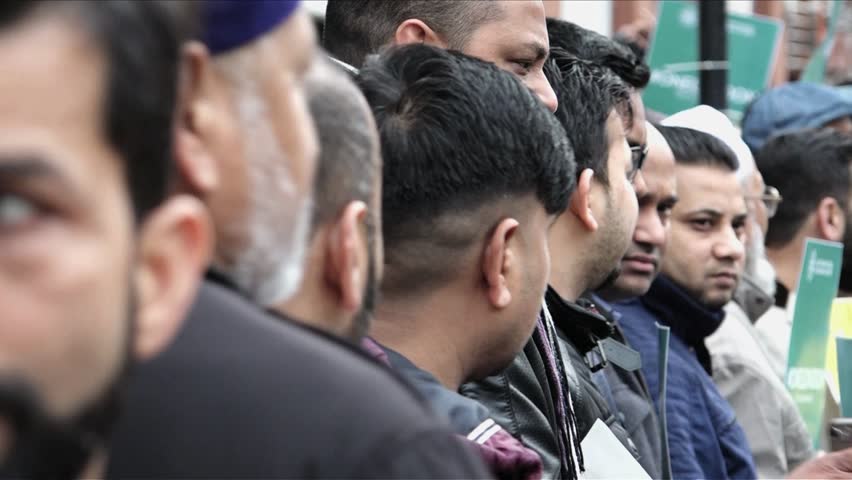 London, United Kingdom (UK) - 04 03 2018: Muslim men standing in a line | Shutterstock HD Video #1009895699
