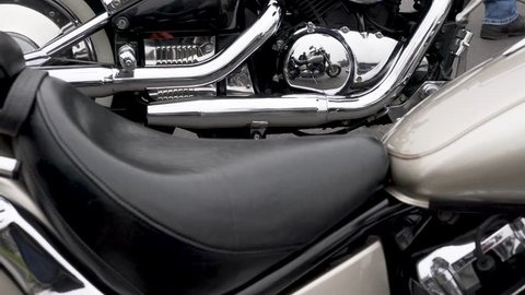 Vertical panning shot over chromed motorcycles