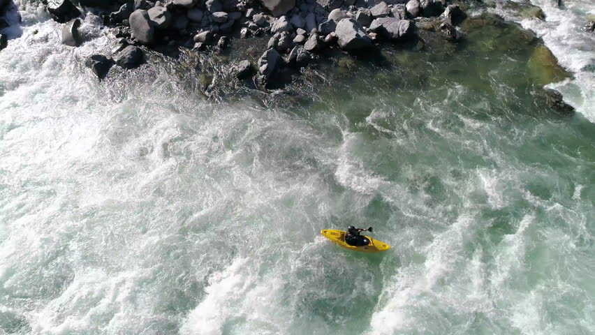 Man Paddling Kayak in Raging Whitewater Aerial
