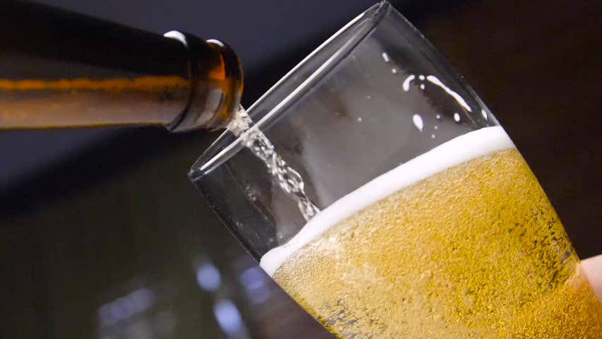 Pour beer from the bottle to the last drop | Shutterstock HD Video #1009910129