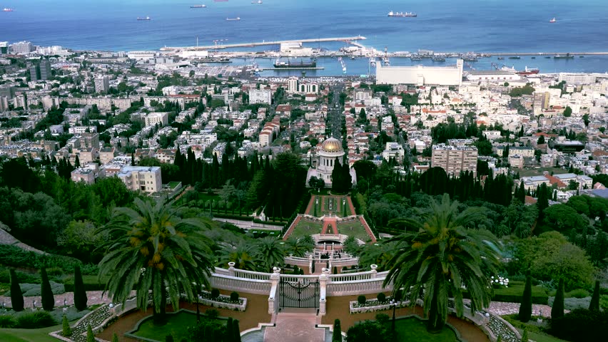 Haifa city harbor and bay panorama with golden dome of Bahai temple from the top of Mount Carmel at overcast winter day. Israel
