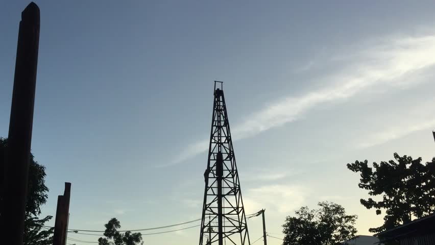 Pile Driver Working at Sunset