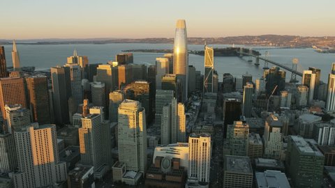 Aerial skyline view of downtown Financial district city skyscrapers Salesforce Tower Bay Bridge San Francisco US 80 Pacific ocean California
