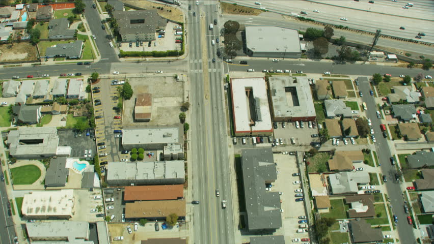 Aerial overhead view of suburban Los Angeles State Freeway commercial and residential properties LA Basin a sedimentary area known as Peninsular Ranges California USA